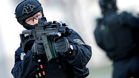 FILE: A Police officer holds a weapon during a training operation of the new BFE+ unit of the German federal police in Ahrensfelde near Berlin, 16 December 2015