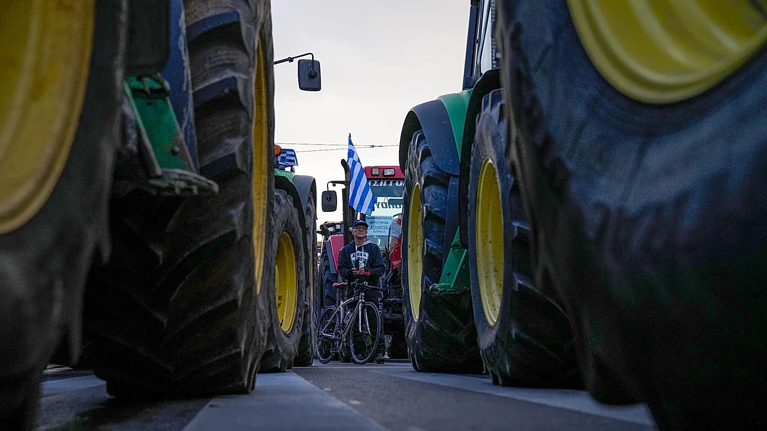 Protesting farmers stand in front of the Greek parliament in Athens, 20 February, 2024
