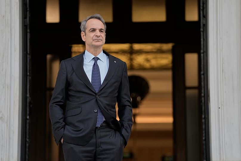 Greece's Prime Minister Kyriakos Mitsotakis waits for the arrival of European Parliament President Roberta Metsola in Athens, 28 November, 2025
