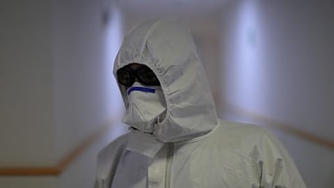 A member of the UME (Emergency Army Unit) wears a protective suit at a facility in Madrid, Spain, on March 31, 2020.