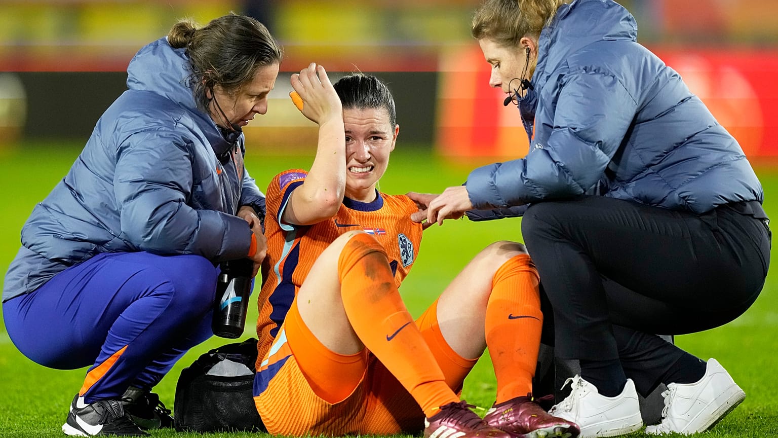 Netherlands' Damaris Egurrola is assisted after hitting her head during the qualifying soccer match for the 2025 European Women's Championship.