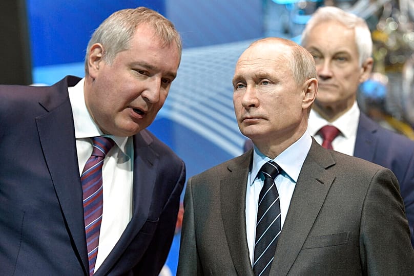 FILE: Russian President Vladimir Putin listens to Roscosmos head Dmitry Rogozin as he visits the Russian rocket engine company Energomash in Khimki near Moscow, 12 April 2019