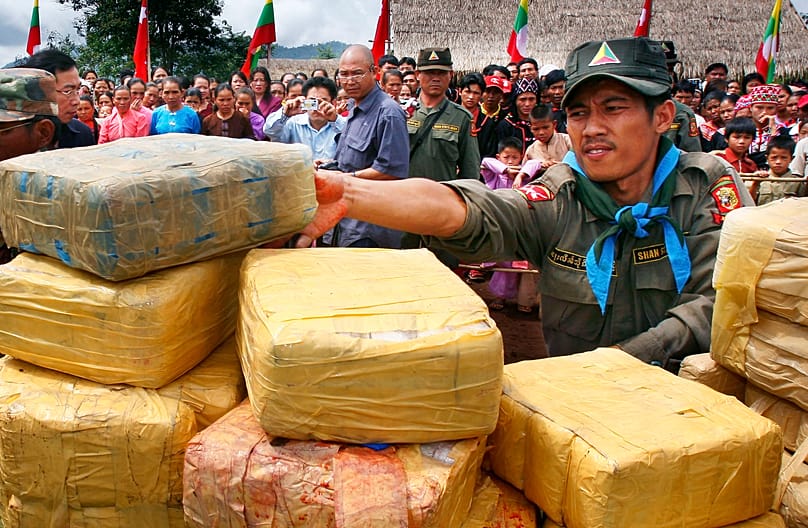 Shan State rebel soldiers of southern Myanmar prepare to burn a load of captured amphetamines, 6 June, 2007
