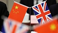 Flags of China and the Union Jack stand during the China-UK Energy Dialogue in Beijing, 17 March, 2025