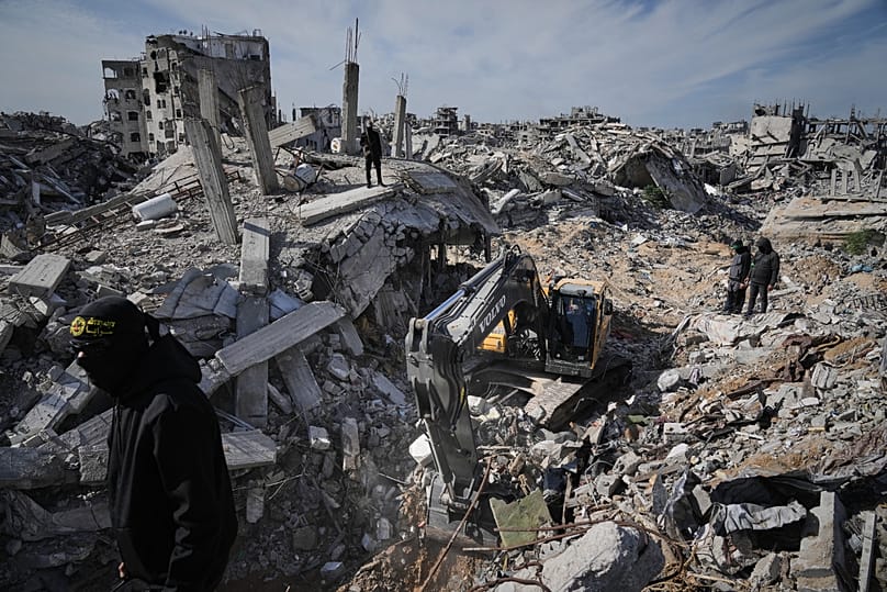 Islamic Jihad and Hamas militants search for the remains of deceased hostages in Beit Lahiya, 3 December, 2025