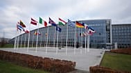 Flags flap in the wind outside of NATO headquarters in Brussels, Wednesday, Dec. 3, 2025. (AP Photo/Virginia Mayo)