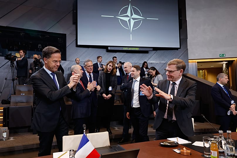Germany's Foreign Minister Johann Wadephul, right, speaks with NATO Secretary General Mark Rutte during a meeting of the North Atlantic Council in Foreign Ministers Session.