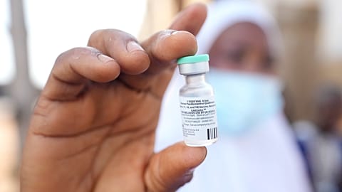 A health worker shows an HPV vaccine during a campaign in Ibadan, Nigeria, on May 27, 2024.