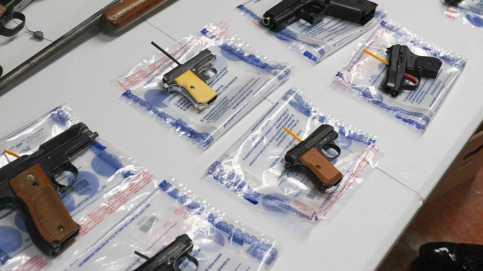 A collection of illegal guns is displayed during a gun buyback event, May 22, 2021, in Brooklyn, NY, US (File Photo)