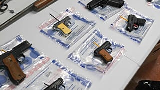 A collection of illegal guns is displayed during a gun buyback event, May 22, 2021, in Brooklyn, NY, US (File Photo)