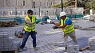 Two men work at a construction site during a heatwave in Madrid, Spain, Friday, Aug. 13, 2021. 
