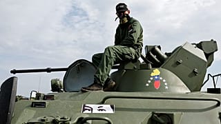 FILE: A serviceman of Venezuela's army on Russian armoured personnel carrier BTR-82A take part in the 2022 International Army Games in Russia's Kaliningrad, 24 August 2022