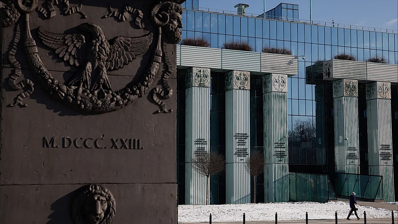 A woman walks in front of Poland's Supreme Court building in Warsaw, 9 February, 2023