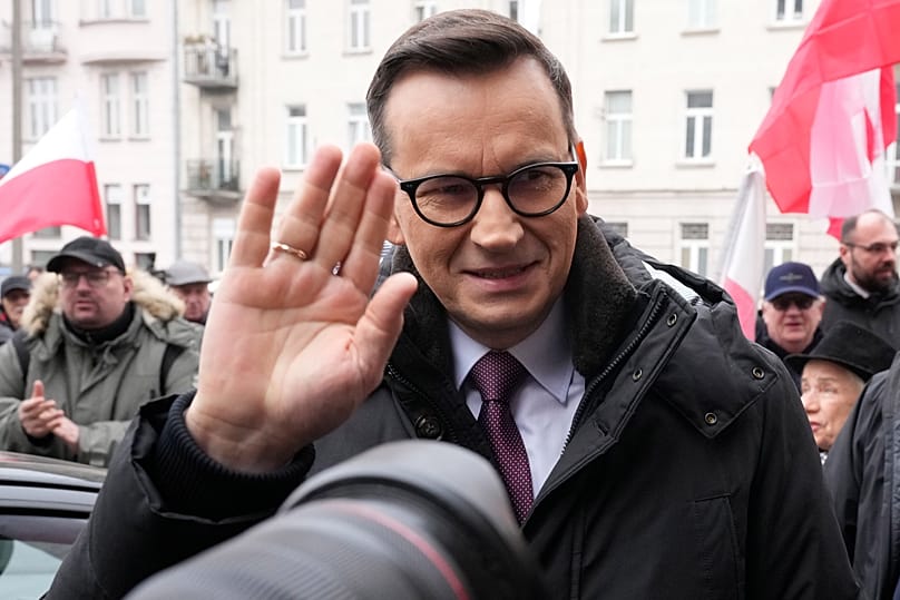 Former Polish Prime Minister Mateusz Morawiecki speaks to supporters before being interrogated by prosecutors in Warsaw, 27 February, 2025