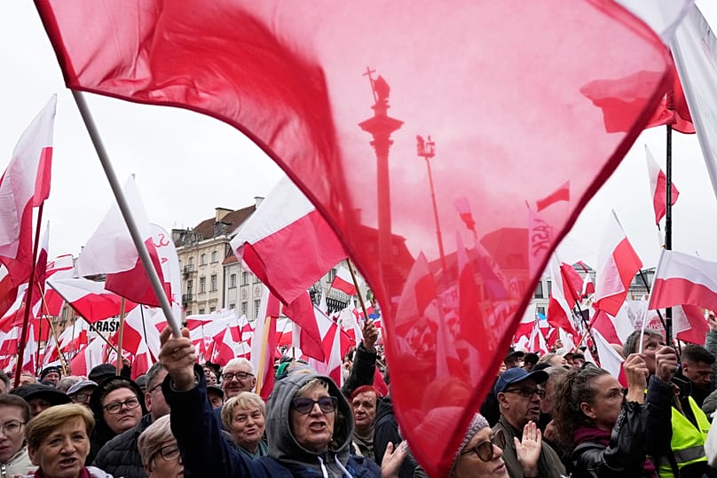Supporters the Law and Justice party attend a rally against illegal migration and the Mercosur agreement in Warsaw, 11 October, 2025