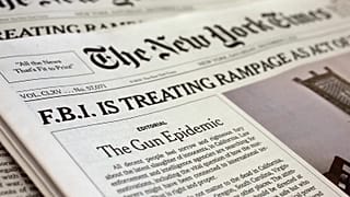 The front page of the New York Times at a news stand, 5 December, 2015