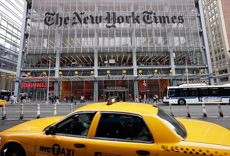 A sign for The New York Times hangs above the entrance to its building, 20 October, 2011