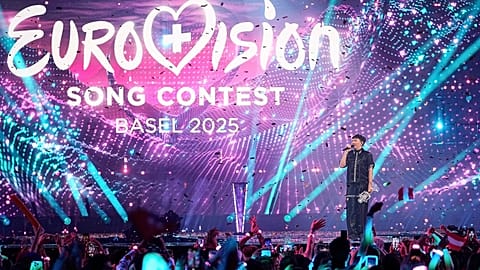 JJ, from Austria, stands on the stage with his trophy after winning the Grand Final of the 69th Eurovision Song Contest in Basel, 18 May, 2025