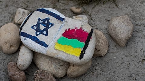 Stones with Israel and Lithuania flags are placed at the Holocaust memorial in Moletai, 29 August, 2016