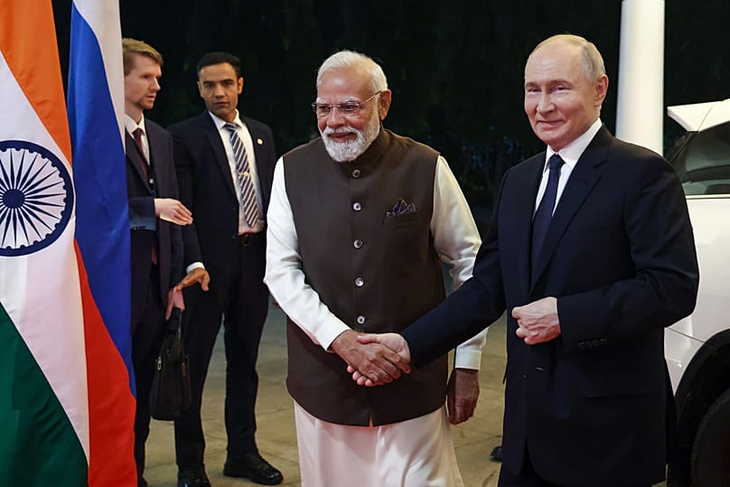 Russian President Vladimir Putin, right, and Indian Prime Minister Narendra Modi arrive at the Indian Prime Minister office in New Delhi, India, Thursday, Dec. 4, 2025.