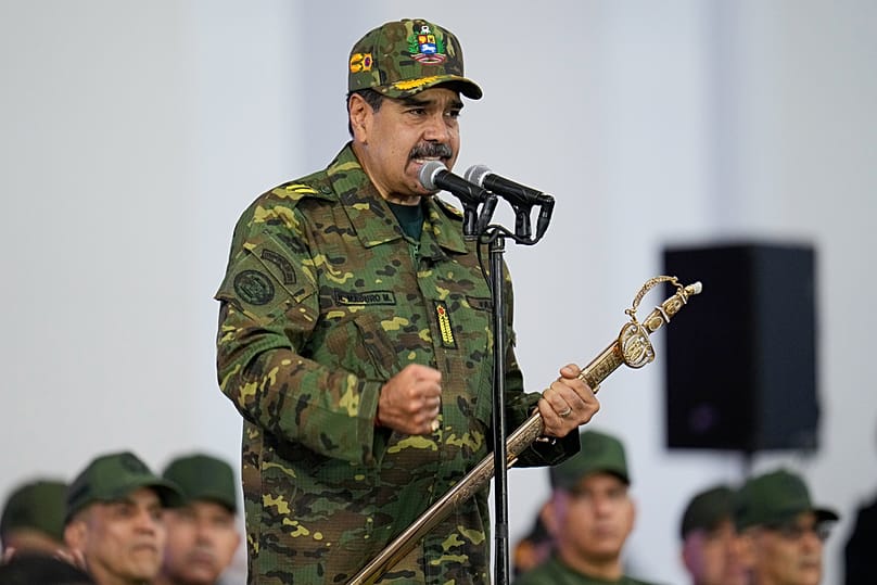 Venezuelan President Nicolas Maduro holds a ceremonial sword said to have belonged to independence hero Simon Bolivar in Caracas, 25 November 2025