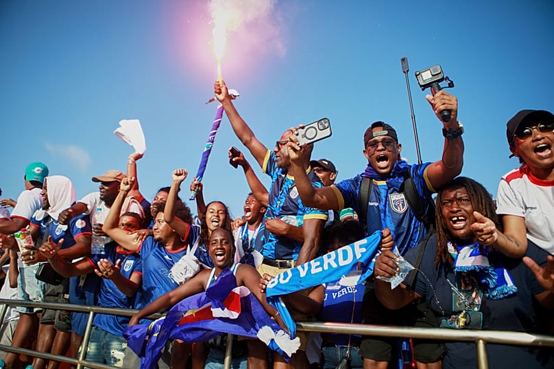 Fans celebrate in the stands after Cape Verde defeated Eswatini in a World Cup qualifying soccer match at Estádio Nacional in Praia, 13 October, 2025
