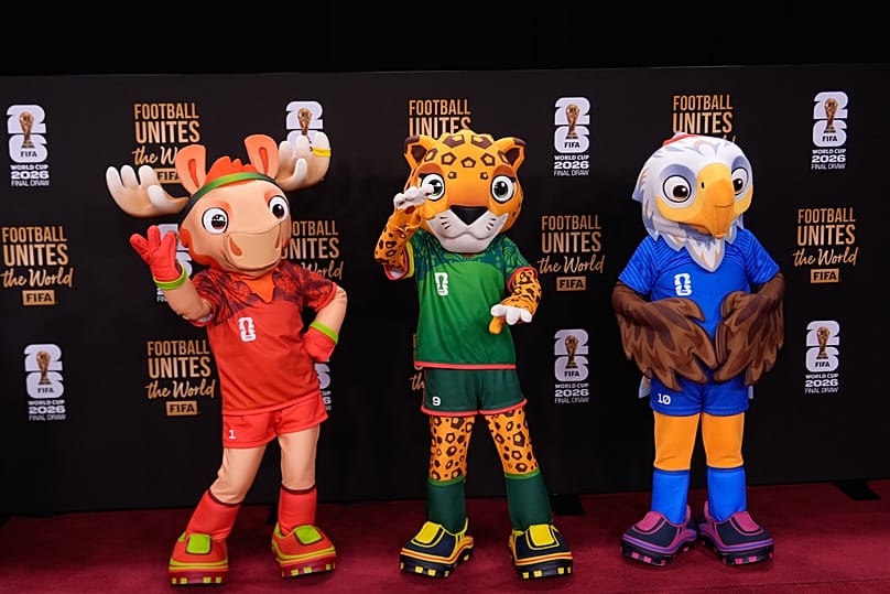 The tournament mascots pose on the red carpet as guests arrive for the draw for the 2026 soccer World Cup at the Kennedy Centre in Washington, 5 December, 2025
