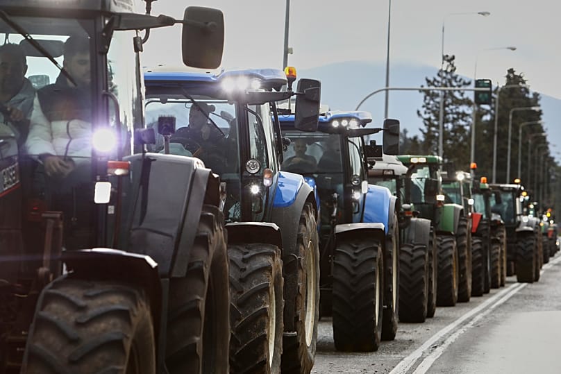 Farmers with their tractors try to block the main access road to Thessaloniki's international airport, 5 December, 2025