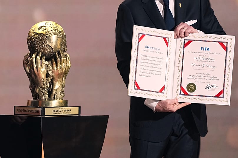 FIFA President Gianni Infantino presents President Donald Trump with the FIFA Peace Prize in Washington, 5 December, 2025