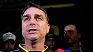 Flavio Bolsonaro, son of ex-President Jair Bolsonaro, speaks during a vigil outside the former president's residence in Brasília, Brazil, Saturday, Nov. 22, 2025.