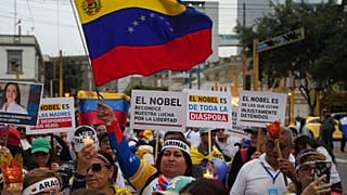 Venezuelan opposition supporters demonstrate ahead of the Nobel Peace Prize ceremony where Venezuelan Maria Corina Machado is among this year's laureates