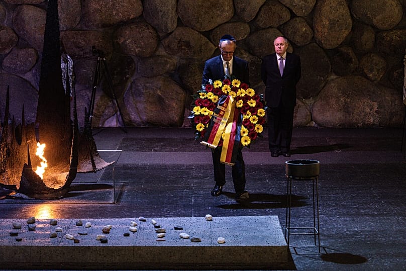 German Chancellor Friedrich Merz lays a wreath at the Hall of Remembrance during his visit to the Yad Vashem Holocaust Memorial Museum in Jerusalem, Sunday, Dec. 7, 2025. 