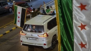 صورة الرئيس السوري الانتقالي أحمد الشرع على سيارة في دمشق، سوريا، الجمعة 5 كانون الأول/ديسمبر 2025