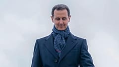 FILE: Bashar al-Assad steps off the plane as he arrives at Vnukovo airport in Moscow, 14 March 2023