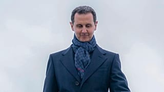 FILE: Bashar al-Assad steps off the plane as he arrives at Vnukovo airport in Moscow, 14 March 2023