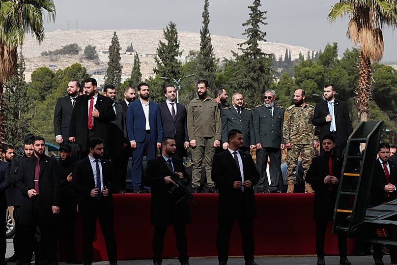 الرئيس السوري الانتقالي أحمد الشرع خلال الاحتفالات في دمشق بمناسبة الذكرى الأولى لسقوط بشار الأسد.