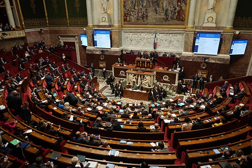 Parliament members vote at the National Assembly in Paris, 9 December, 2025 