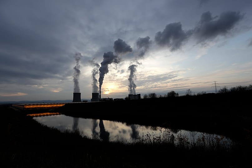 Smoke rises from chimneys of the Turow power plant located by the Turow lignite coal mine near the town of Bogatynia, 19 November, 2019