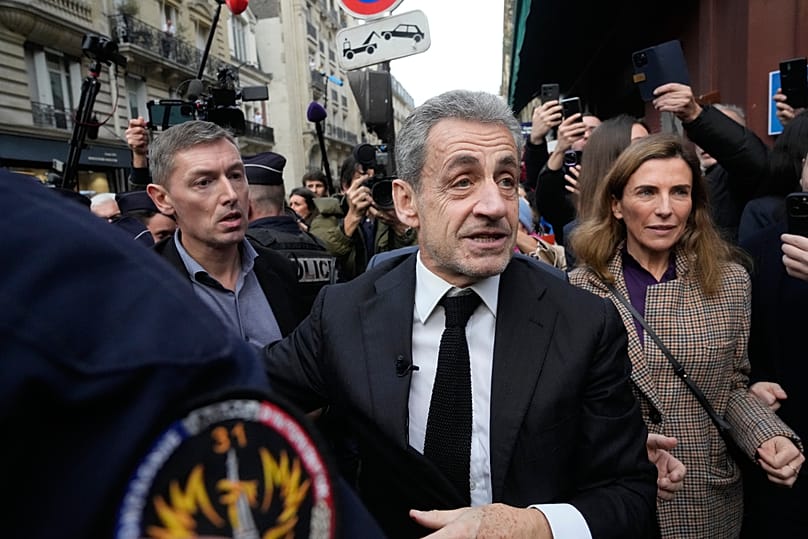 Former French President Nicolas Sarkozy arrives to sign his book "Diary of a Prisoner" in a Paris bookshop, 10 December, 2025