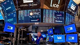 A trader works on the floor of the New York Stock Exchange, 20 March, 2024