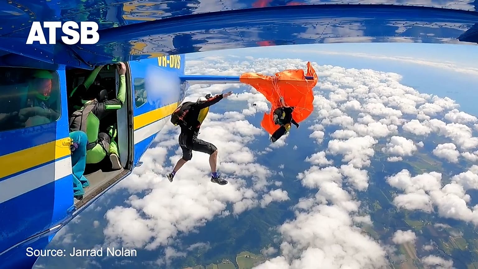 Skydiver dangles 4,500 metres in the air after parachute snags on plane tail 