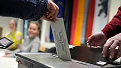 A resident casts a vote at a polling station in Berlin, 23 February, 2025