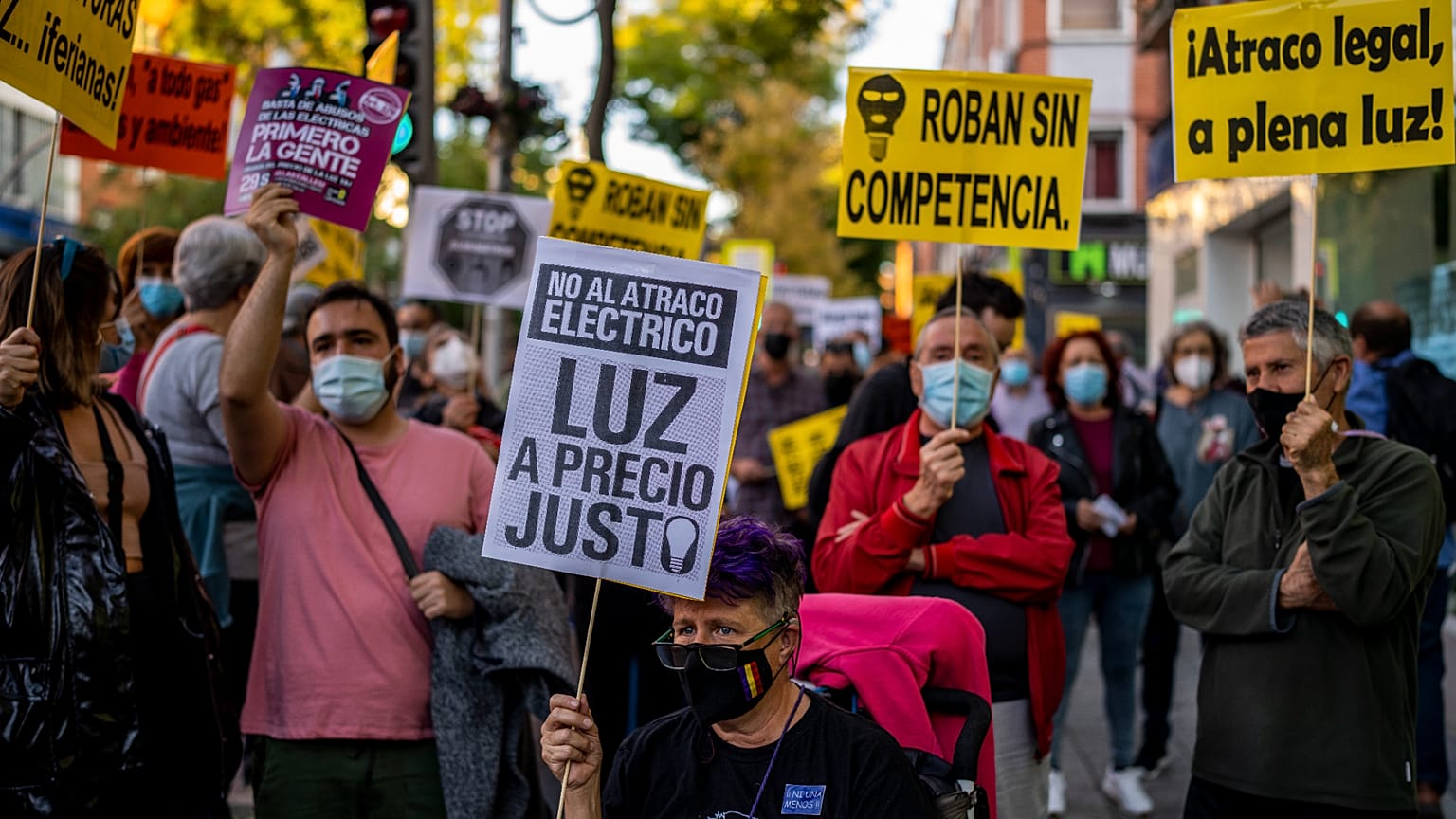 People take part in a protest against the increase of the price of electricity in Madrid, Spain, Wednesday, Oct. 6, 2021. 