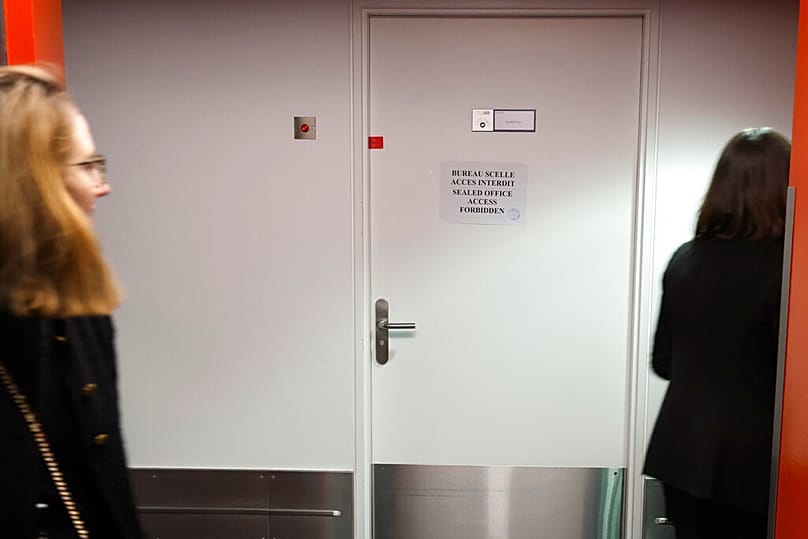 FILE: People walk past European Parliament Vice President Eva Kaili's office door, which is sealed, at the European Parliament in Strasbourg, 13 December 2022