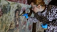 Archaeologist cleans and restores frescoes inside a 3rd-century tomb where a rare early Christian depiction of Jesus as the "Good Shepherd" was discovered.