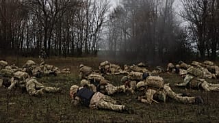 In this photo provided by Ukraine's 65th Mechanised Brigade press service, recruits attend drills at a training ground in the Zaporizhzhia, Ukraine, Friday, Dec. 12, 2025