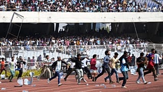 Angry Indian fans vandalize stadium chairs as they run on to the field after failing to get a glimpse of Argentine soccer star Lionel Messi at the Salt Lake Stadium, in India.
