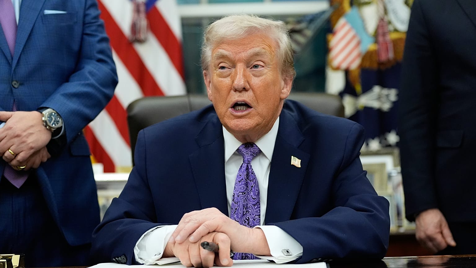 President Donald Trump speaks during a signing ceremony in the Oval Office of the White House,