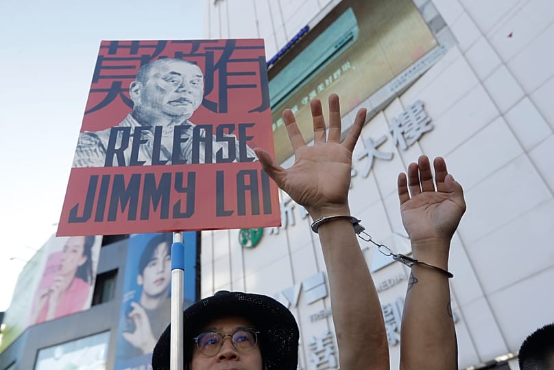 Hong Kong activists and supporters in Taiwan gather to support imprisoned Hong Kong activist publisher Jimmy Lai for the national security trial in Taipei, Aug. 24, 2025.