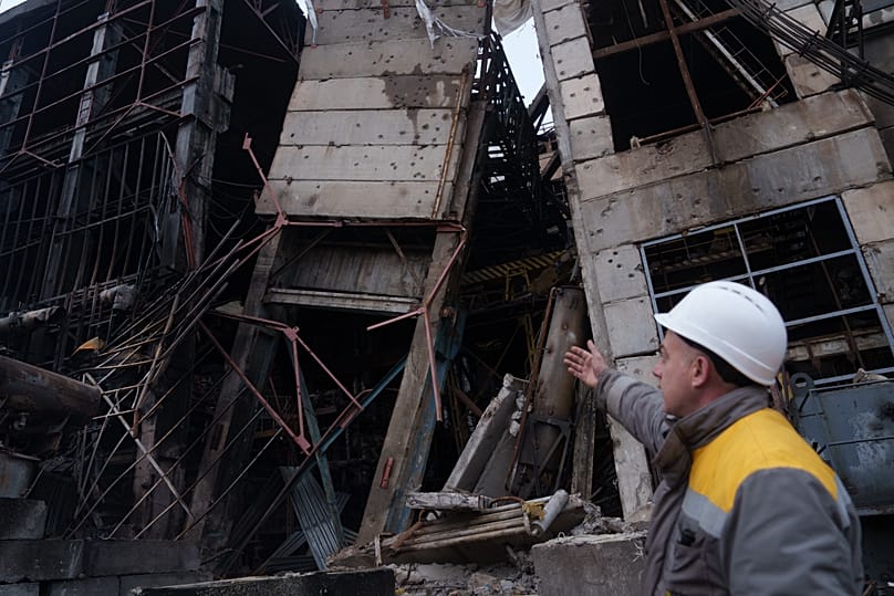A worker shows damages of a production hall after a recent Russian missile attack at DTEK's power plant in Ukraine, 10 December, 2025